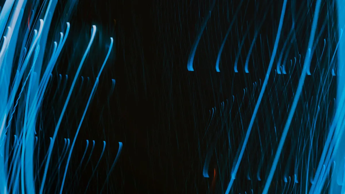 Dynamic abstract image of swirling blue light trails on a dark background. — Photo by Mahdi Bafande on Pexels