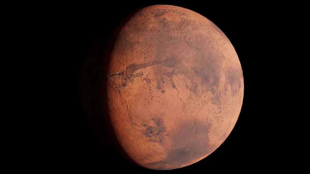 A high-resolution image capturing Mars with its surface details visible in space. — Photo by Zelch Csaba on Pexels